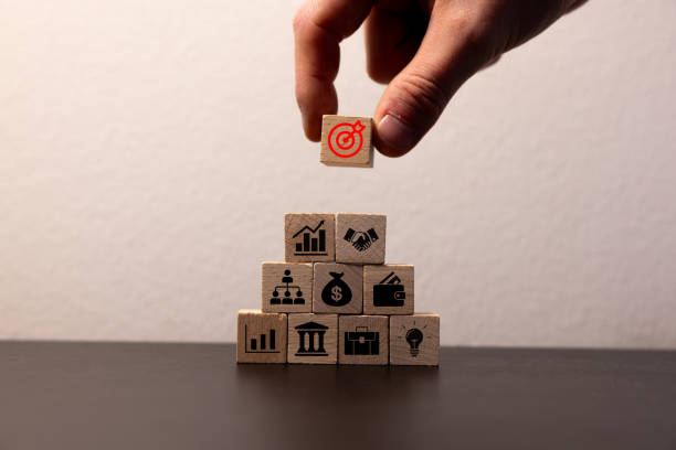 istock Hand arranging wood block stacking with business strategy and Action plan, targeting the business concept. Business development concept. 2084311986