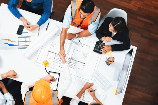 istock Diverse group of civil engineer and client shakes hand after. Prudent 2084351602