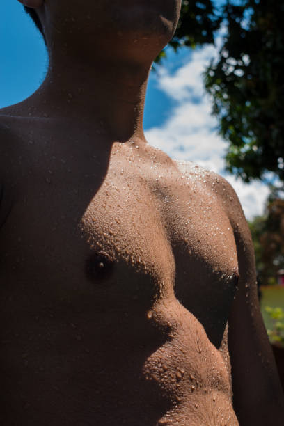 istock Naked male torso with water 2084374203