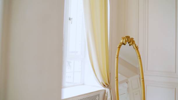 istock Oval old mirror frame. Beautiful vintage mirror in a photo studio. 2084388535