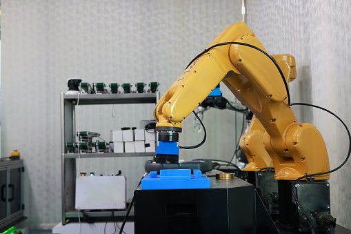 Industrial Programmable Robotic Arm in a Factory Development Workshop