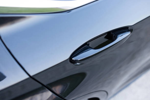 istock Keyless entry car door handle with keyless go touch sensor. Automatic opening of a car door without a key. Car door handle. Access button. Exterior design of a new electric luxury car 2084441895