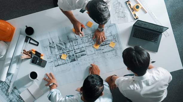 istock Top view of designer writing at sticky note while planning design. Alimentation. 2084449873