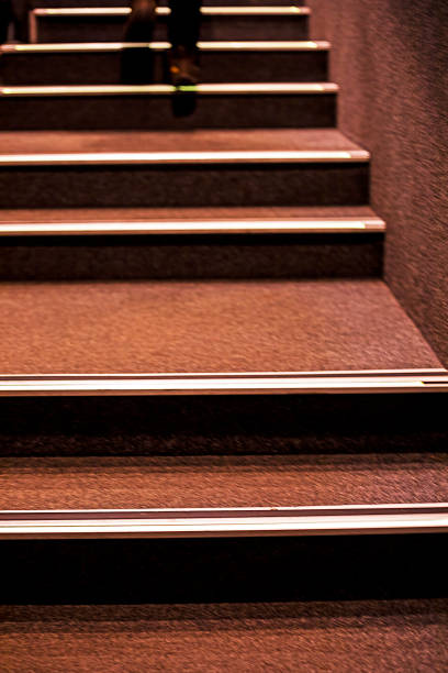 staircase in a cinema covered with brown carpet