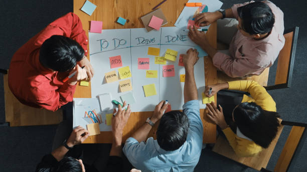 istock Top view of diverse people writing and making scrum task board. Convocation. 2084619611