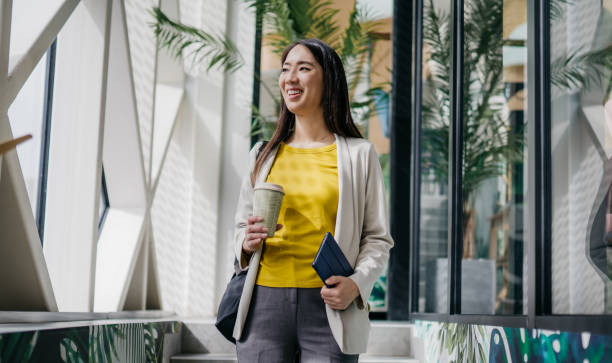 istock Smiling woman leaving her office 2084624865