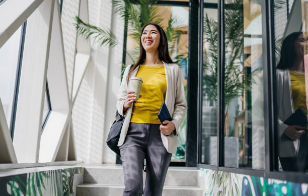 istock Smiling woman leaving her office 2084626993