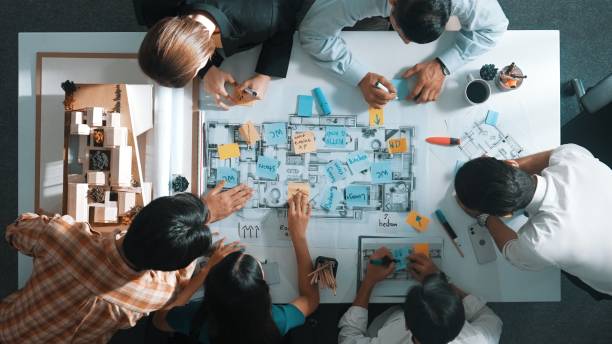 istock Top view of project manager or engineer writing at blueprint. Alimentation. 2084631200