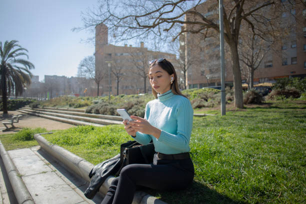 istock Latina woman using cell phone 2084635425