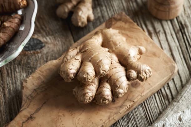 istock Fresh ginger root on a wooden cutting board 2084644882