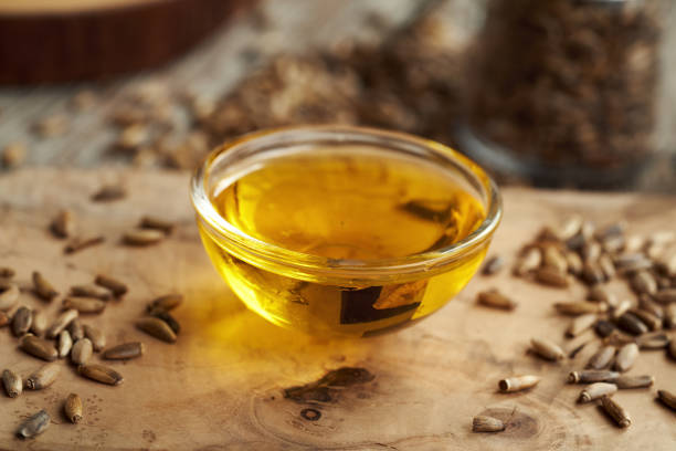 istock Milk thistle oil and seeds on a table 2084645913