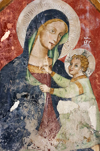 Puglia, Italy. Madonna with child, from the Church of Santo Stefano, at Soleto Madonna with child, a fresco in the Church of Santo Stefano, in the small town of Soleto, in Puglia region. Italy. The frescos in this church were painted between the end of the XIVth and the mid XVth century medieval fresco stock pictures, royalty-free photos & images
