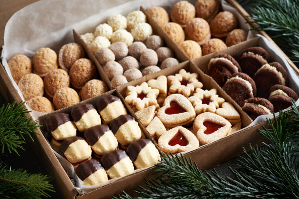istock Variation of handmade Christmas cookies in a gift box on a table 2084661578