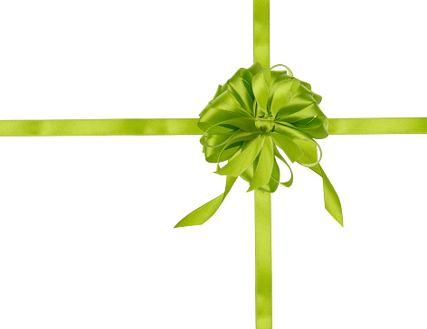 Green ribbon with a cross and a big bow on an isolated background, packaging for a gift. Top view