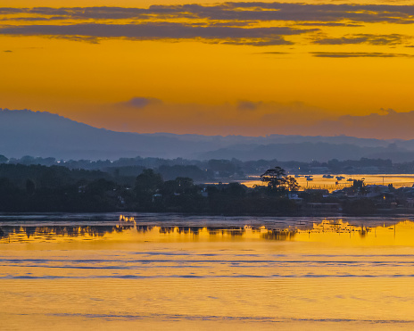 Aerial sunrise over Brisbane Water at Woy Woy Waterfront on the Central Coast, NSW, Australia.