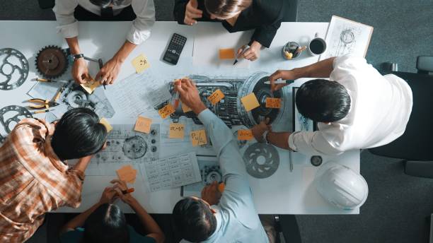 istock Top view of engineer team talking about turbine engine structure. Alimentation. 2084694798
