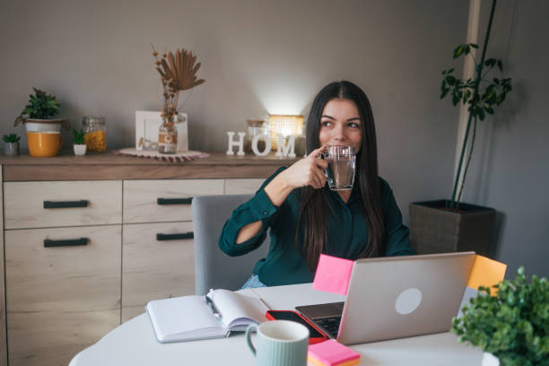 istock A young business woman is working from home. 2084733615