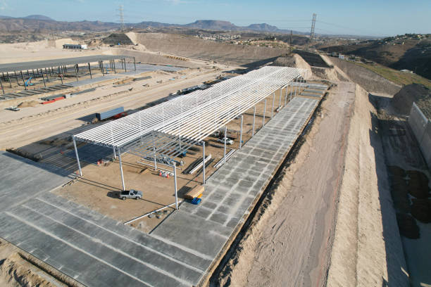 istock 8-Aerial view by drones of an industrial warehouse under construction 2084738359