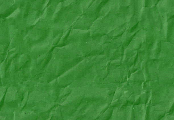 istock Seamless crumpled dark green kraft paper texture. Empty textured sheet. 2084740999