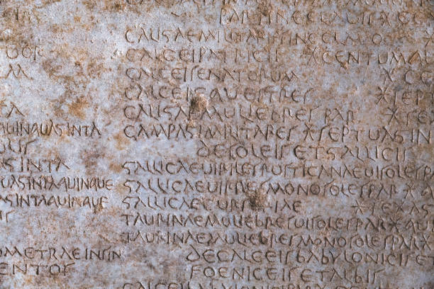istock Ancient Roman script on stone, text of Diocletian's edict detailing prices in Latin language, historical artifact from 4th century. Retro text background. Kusadasi, Turkiye (Turkey) 2084749475