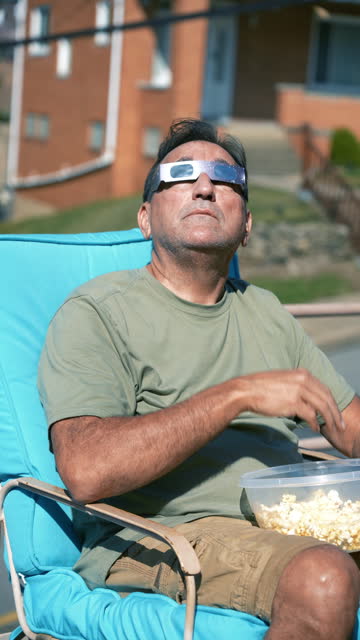 Vertical View of Man Viewing Solar Eclipse