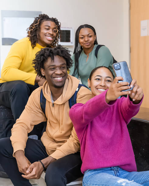 istock Group of students taking a selfie on college steps 2084764547