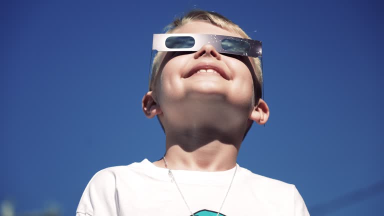 Young Boy Looks at Eclipse