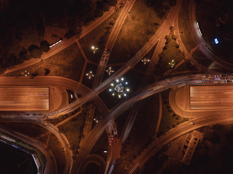Aerial view  of vehicle traffic at a road Intersection at night. Antalya, Turkey.