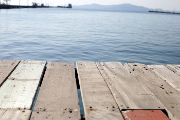 Wooden boardwalk with blue sea