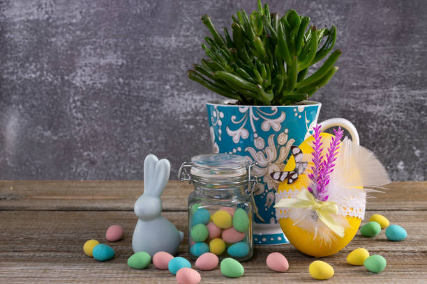 istock Succulent in a cup, Easter decorated egg, candies and bunny. 2084839263