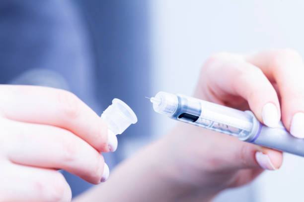 istock insuline pen is opened by woman 2084853387
