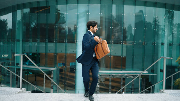 istock Successful businessman celebrate for getting promotion while walking. Exultant. 2084965569