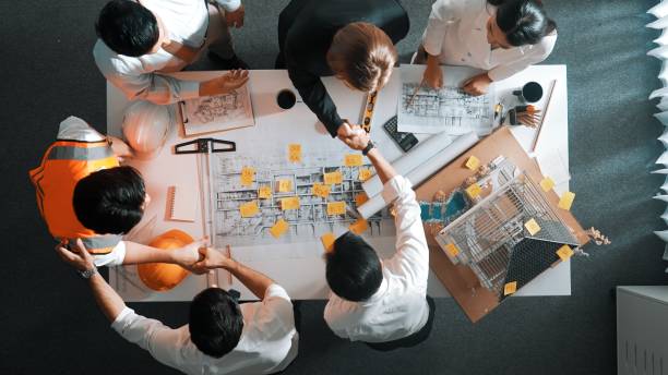 istock Top view of smart team pointing and shake hand about construction. Alimentation. 2084979246