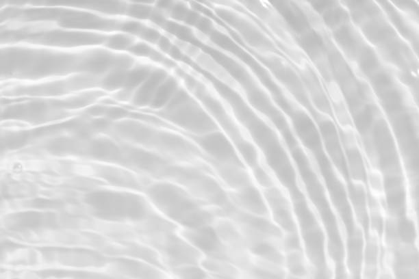 istock White water surface texture with ripples, splashes, and bubbles. Abstract summer banner background Water waves in sunlight with copy space cosmetic moisturizer micellar toner emulsion. White water. 2085013200