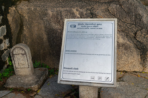 Mahabalipuram, India - 28 November 2023, Picture of board of Draupadi bath at UNESCO world heritage site of Mahabalipuram. Archeological survey of India, Chennai, Caves history, culture, art, carving