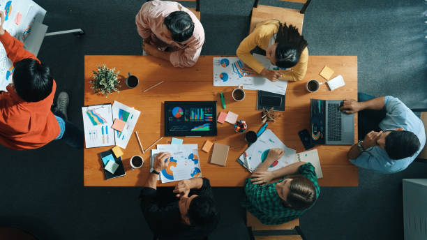 istock Top view of investor brainstorm while look at financial statistic. Convocation. 2085048767