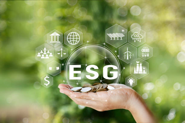 istock ESG icon on gold coin in hand man. Net zero emission Idea innovation. Environmental, social,Governance. Green energy icon around it. Green Energy Renewable Sustainable concept. carbon neutrality 2050 2085103083