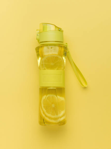 istock A bottle of water and lemon for training on a yellow background. 2085125197