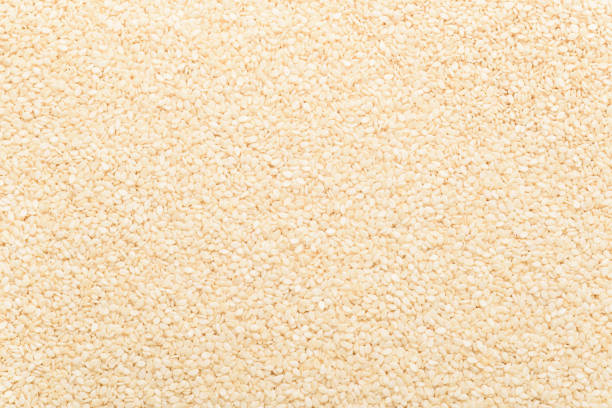 White sesame seeds, an ingredient for making vegetarian and healthy food. Close-up image of food background texture stock photo