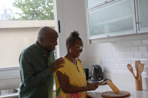 istock Happy  black senior couple cooking 2085153878