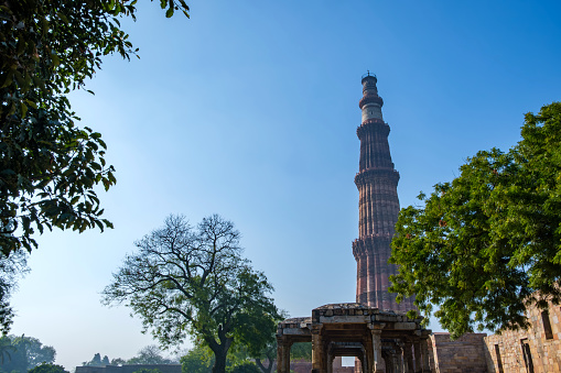 Delhi, India - March 10 2024: The Qutub Minar at Delhi India. The height of Qutub Minar is 72.5 meters, making it the tallest minaret in the world built of bricks.