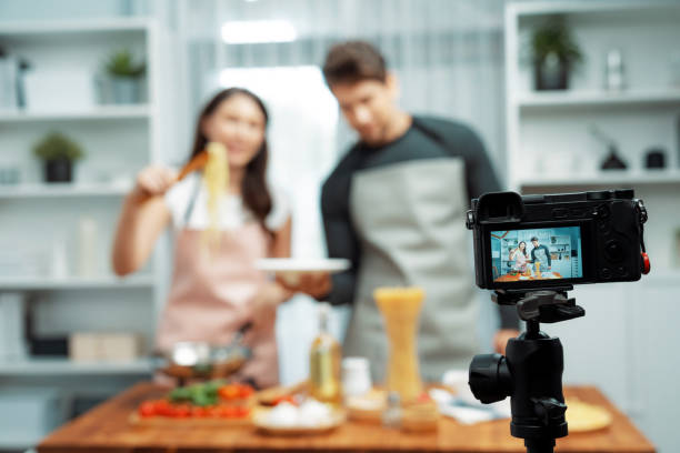 istock Chef influencers cooking special spaghetti with tongs to fried pan. Postulate. 2085252917