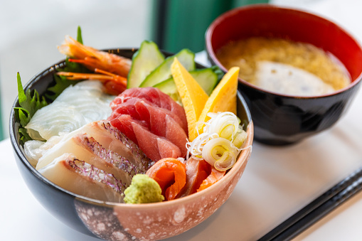 An assortment of raw sliced fish over rice in a bowl known as Kaisendon in Japanese.