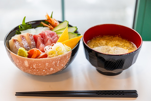 An assortment of raw sliced fish over rice in a bowl known as Kaisendon in Japanese.