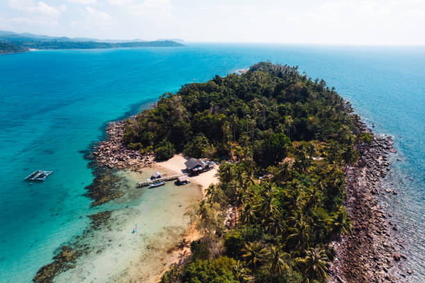 istock Tropical island from above and clear blue sea 2085310720