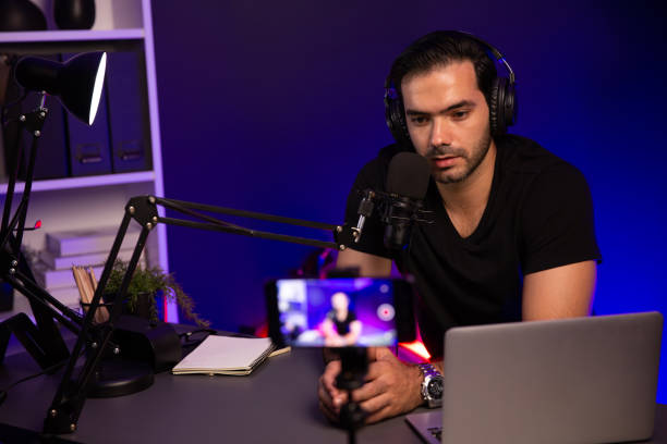 istock Broadcaster talking to listener on live streaming, recording phone. Surmise. 2085332993