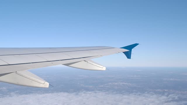 Airplane Wing in Flight with Place for Text