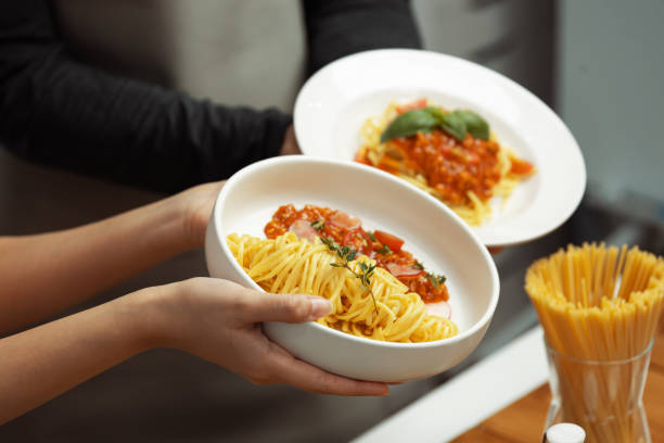 istock Close up hand couple chef influencers completely cooked spaghetti. Postulate. 2085406221