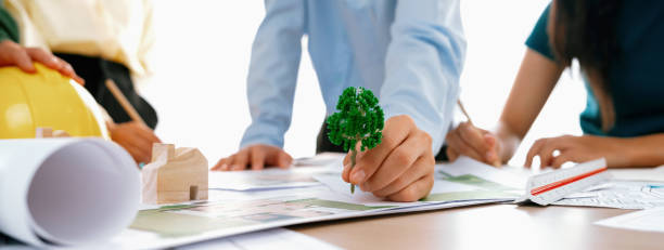 istock Architect team discussing the use of green design in project. Delineation. 2085448119