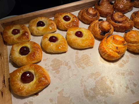 freshly baked Danish pastry with apricot jam fruity jelly super delicious warm fresh buttery baked pastries with apricot and peach